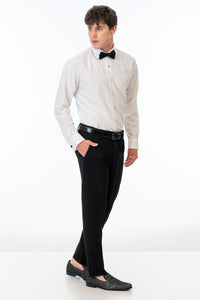side view of man wearing Black Euro Slim Fit Suit pants, white shirt, and bow tie