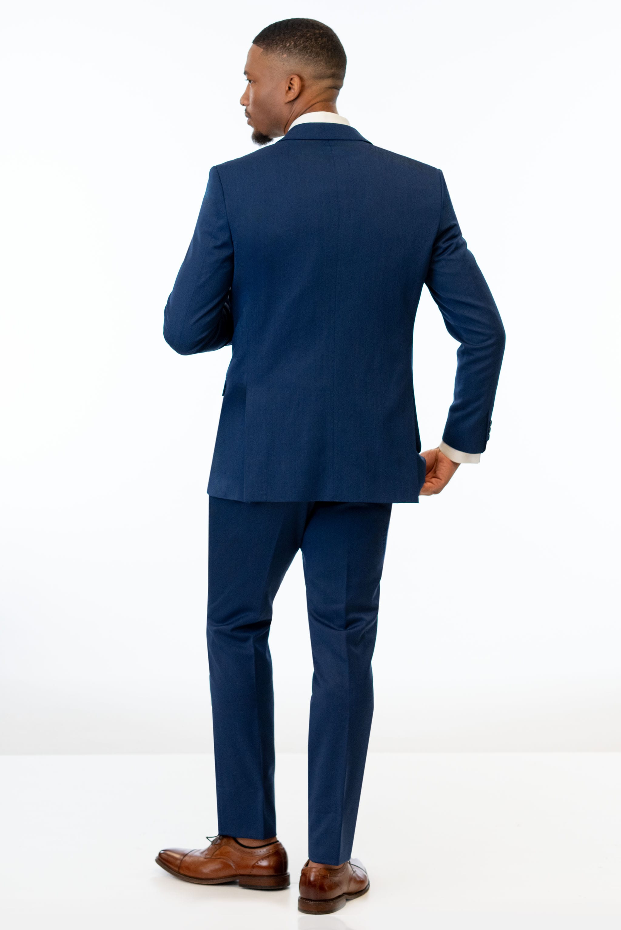 back view of man wearing Blue Performance Stretch Slim Fit Suit 
