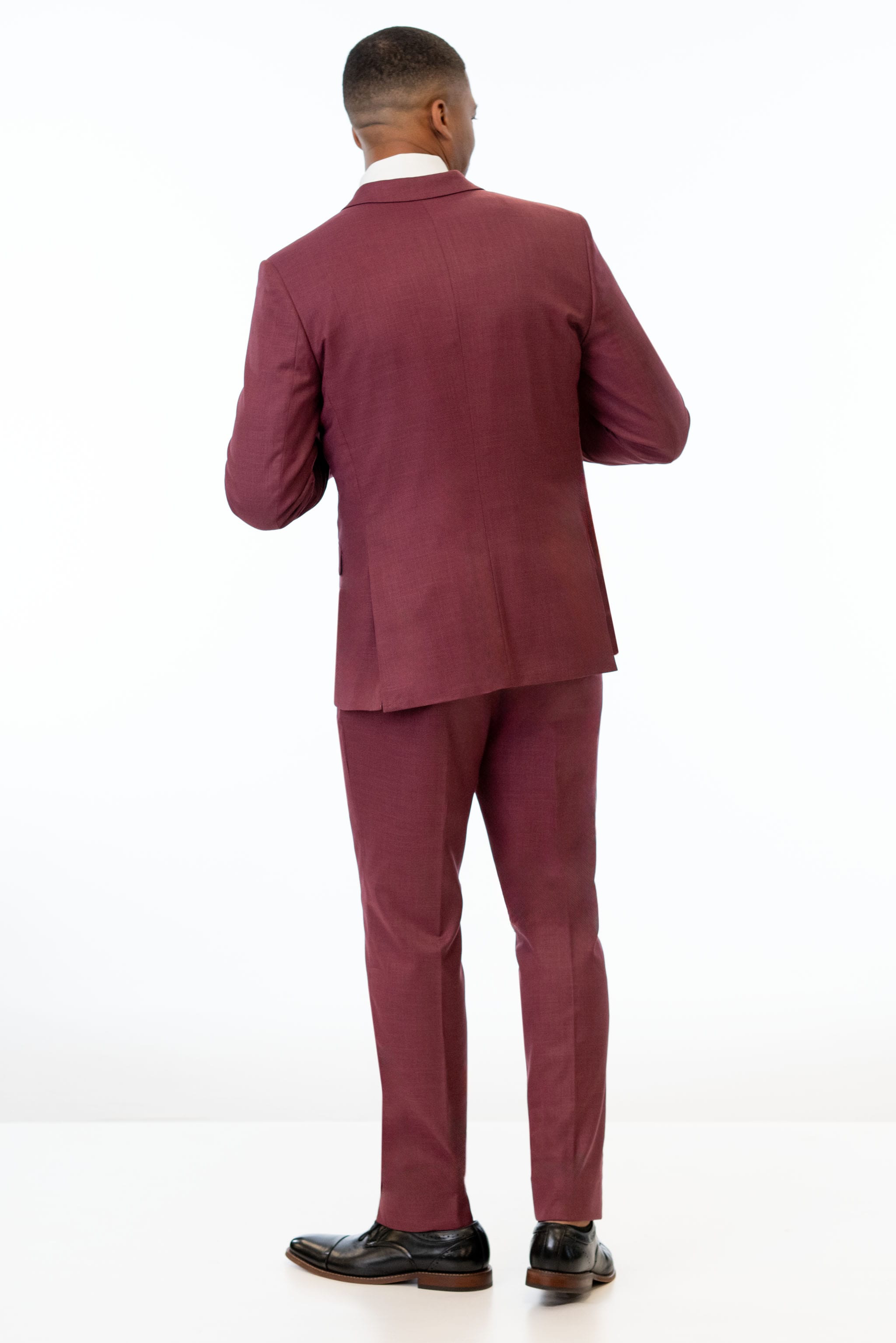 back view of man wearing Brick Stretch Slim Fit Suit 