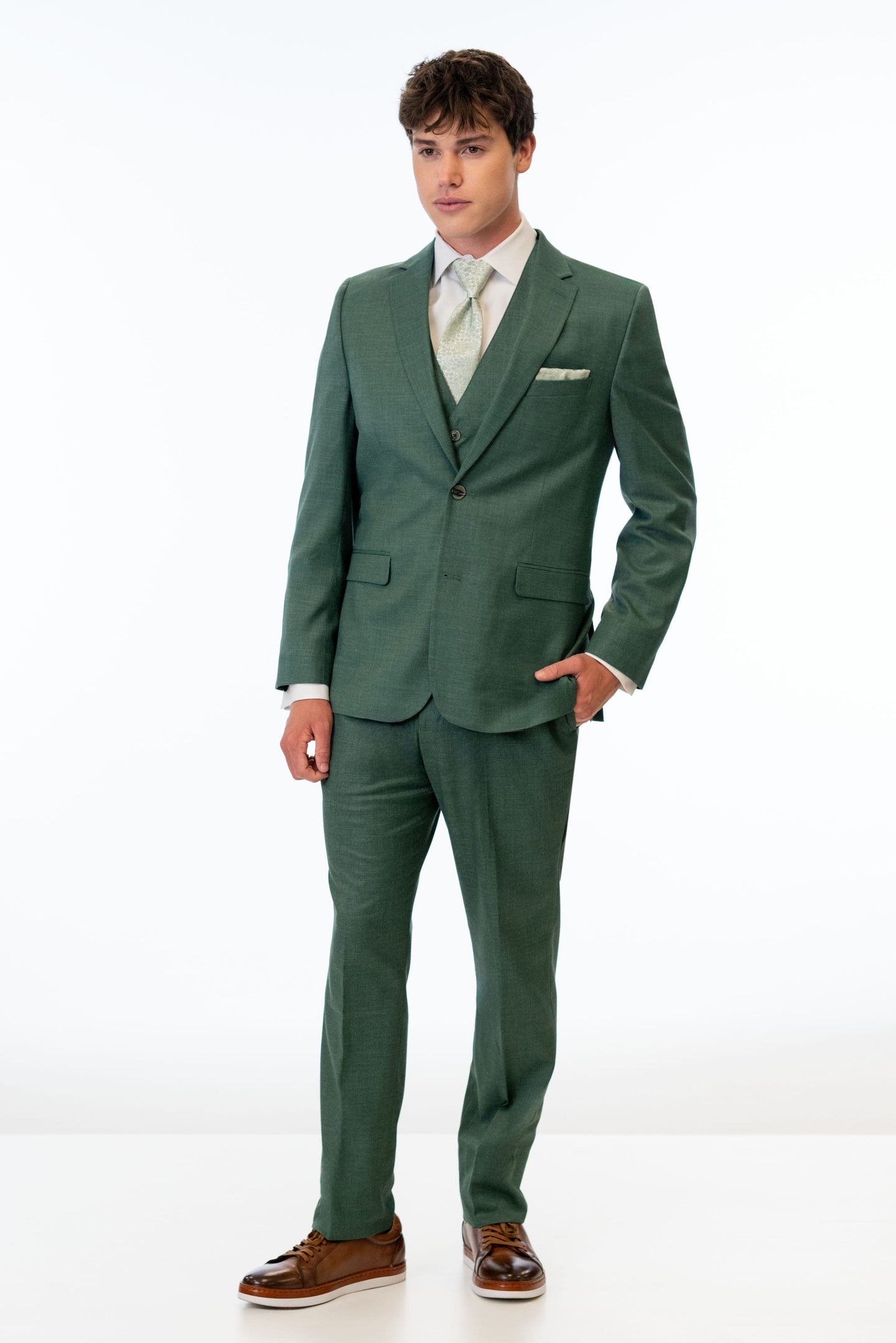 man wearing Forest Green Stretch Slim Fit Suit with white shirt and floral green tie