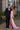 prom guy in black tux and teardrop bow tie with prom girl in pink strapless gown