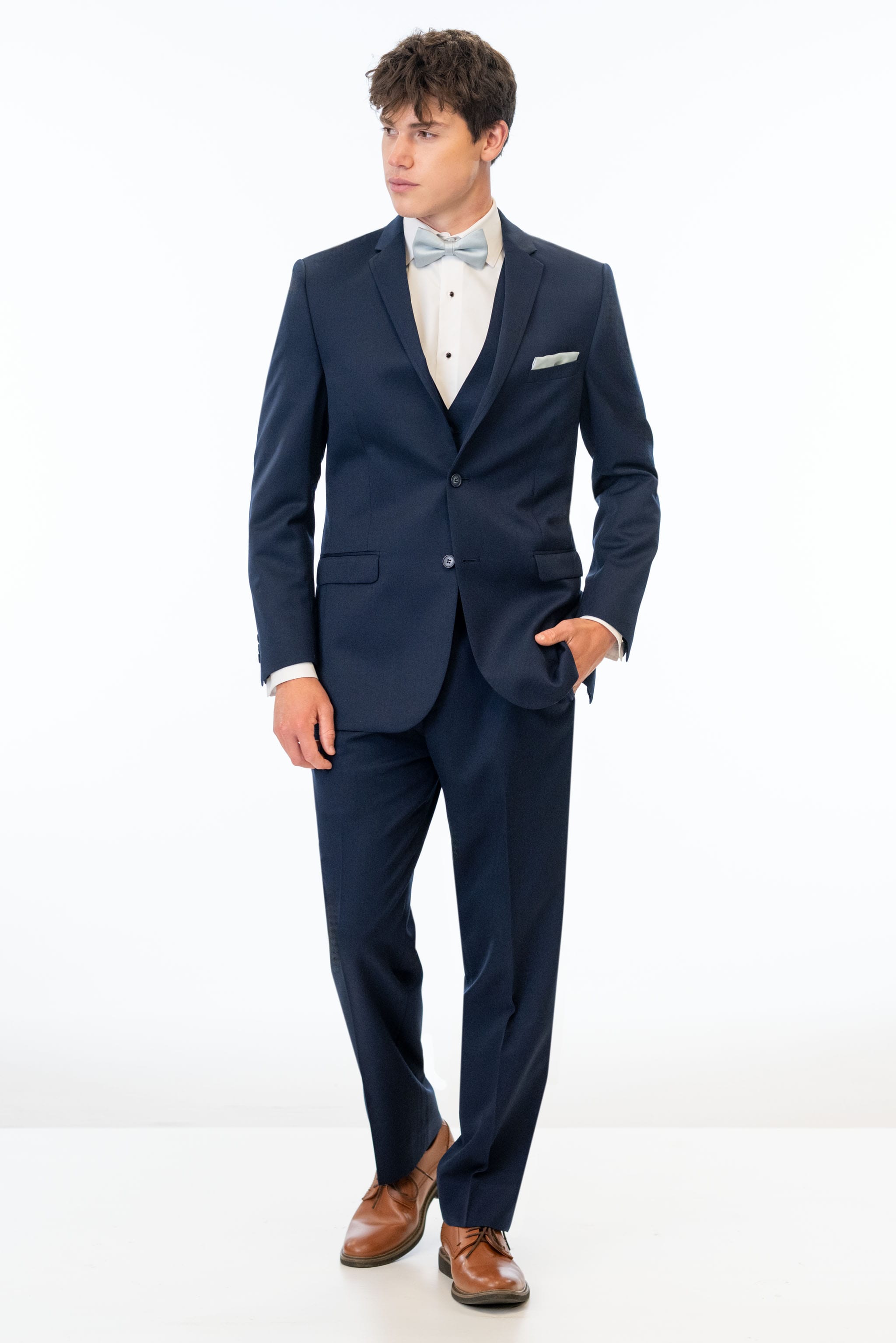 man wearing Navy Sterling Slim Fit Suit with white shirt and bow tie