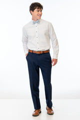 man wearing Navy Sterling Slim Fit Suit pants, white shirt, and bow tie