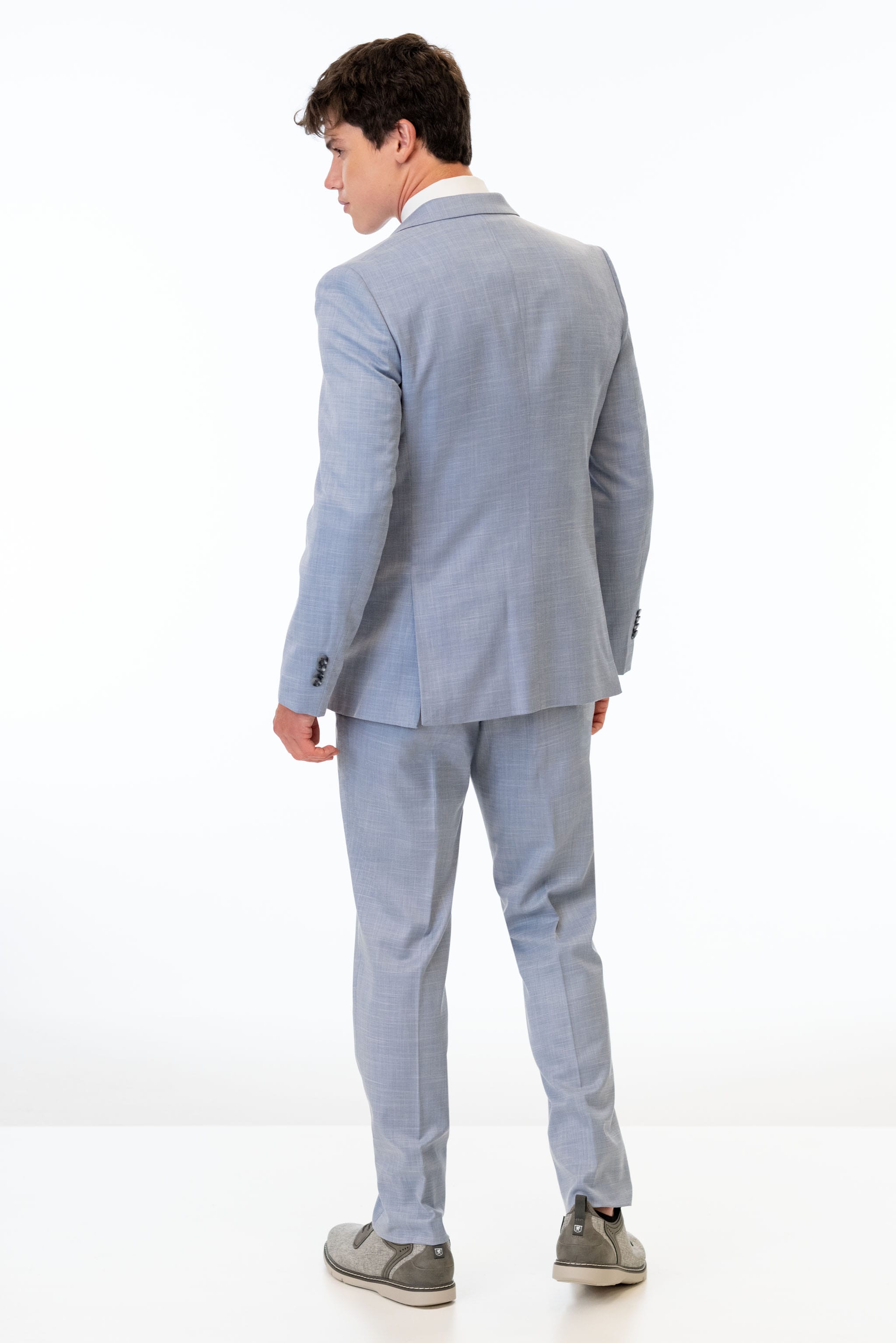 back view of man wearing Oxford Blue Stretch Slim Fit Suit 