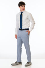 side view of man wearing Oxford Blue Stretch Slim Fit Suit pants, white shirt, and navy blue tie