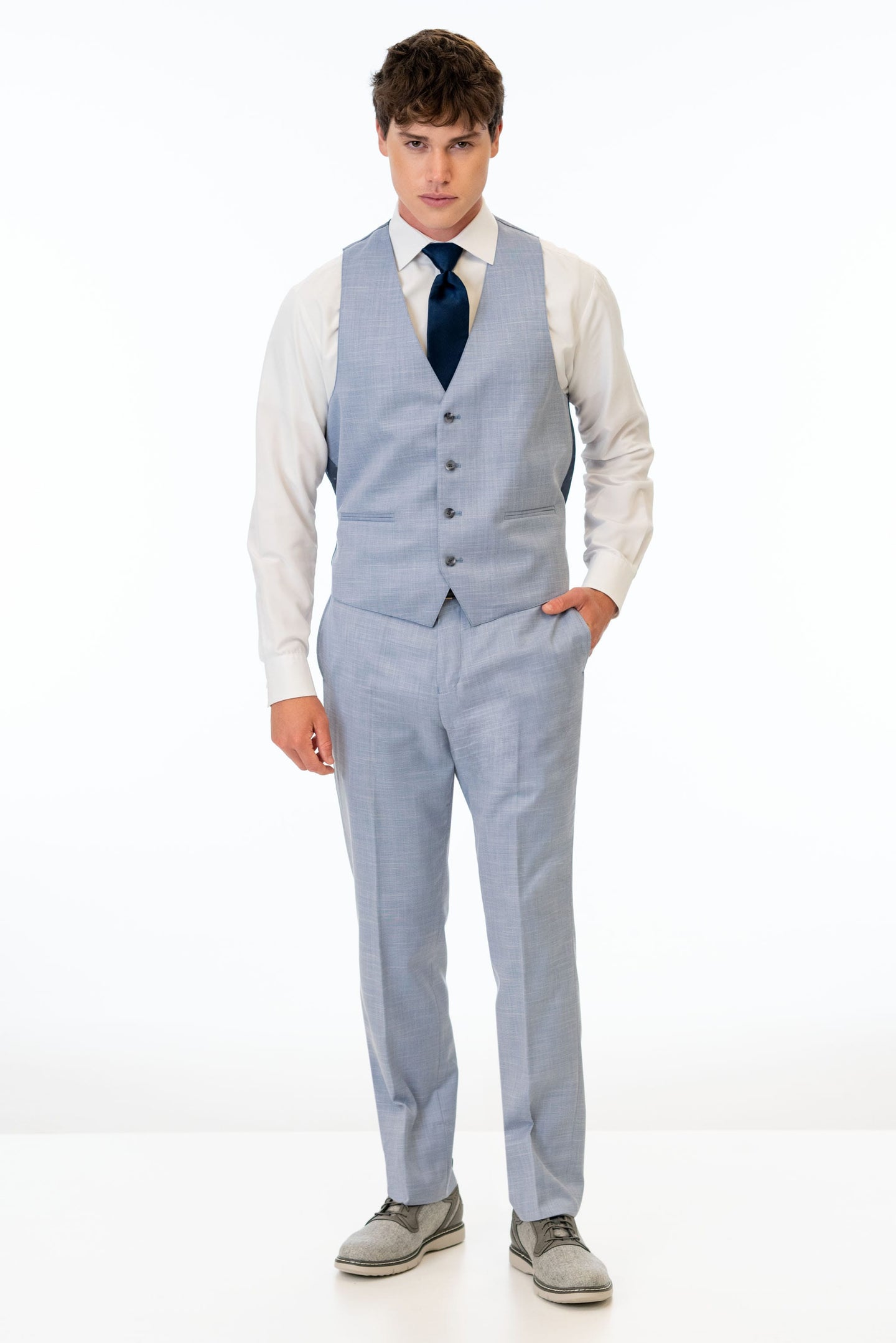 man wearing Oxford Blue Stretch Slim Fit Suit pants and vest
