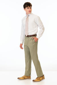 side view of man wearing Sage Green Stretch Slim Fit Suit pants, white shirt, and pink tie