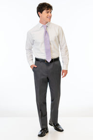Man wearing a white dress shirt, Steel Grey Sterling pants, and a purple tie on a white background