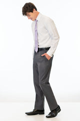 side view of man wearing Steel Grey Sterling Slim Fit pants, white shirt, and lavender tie