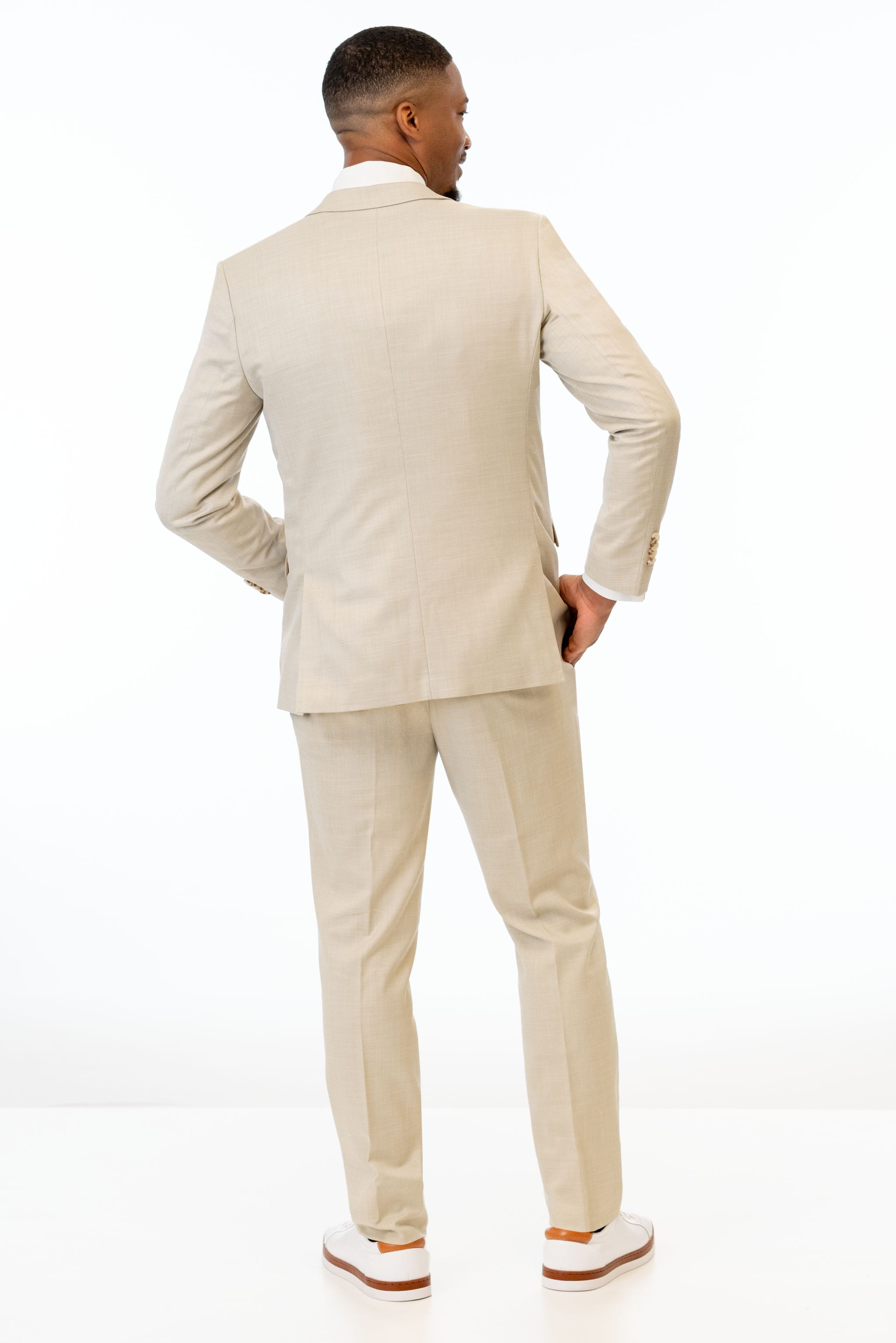 back view of man wearing Tan Stretch Slim Fit Suit 