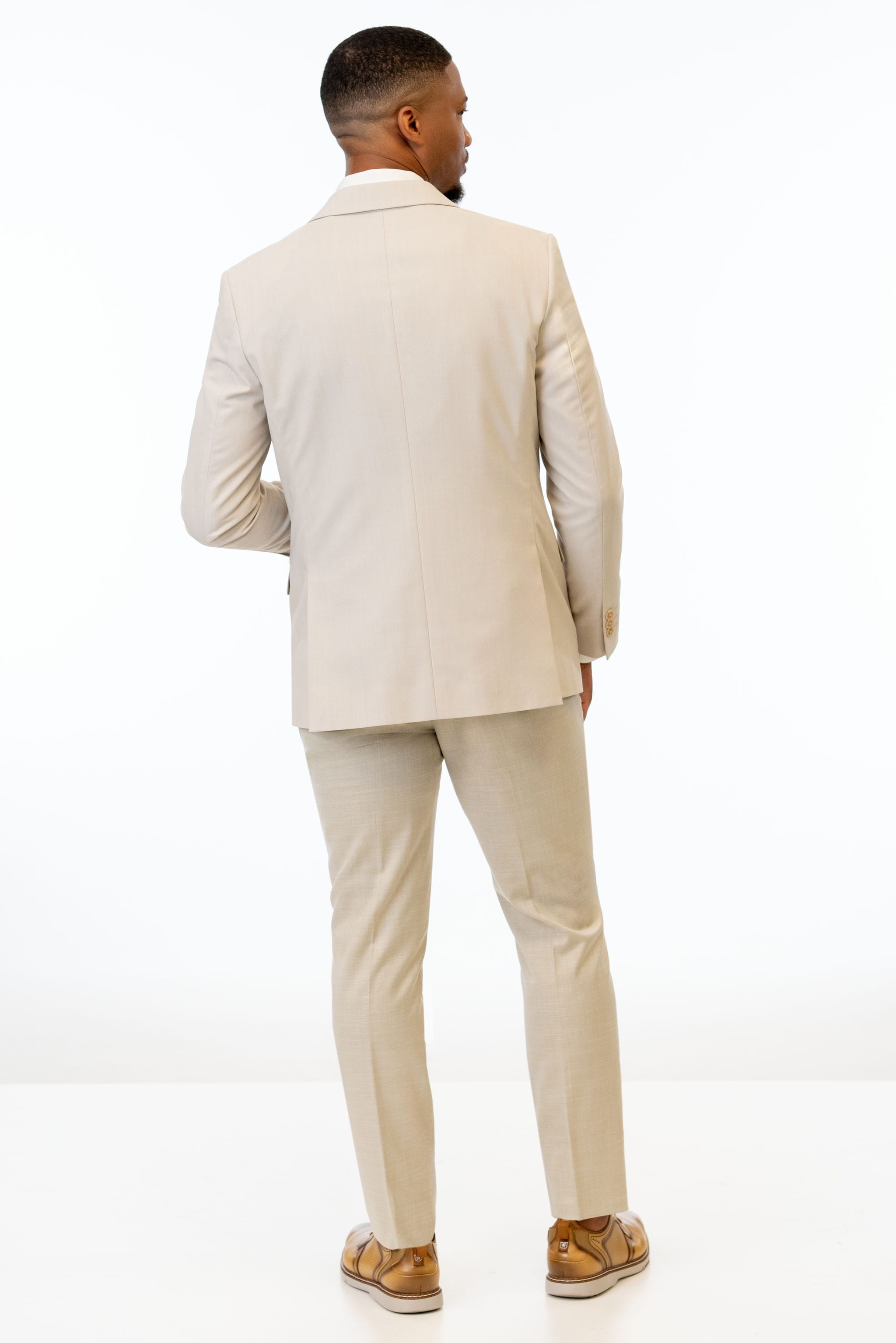 back view of man wearing Tan Performance Stretch Slim Fit Suit 