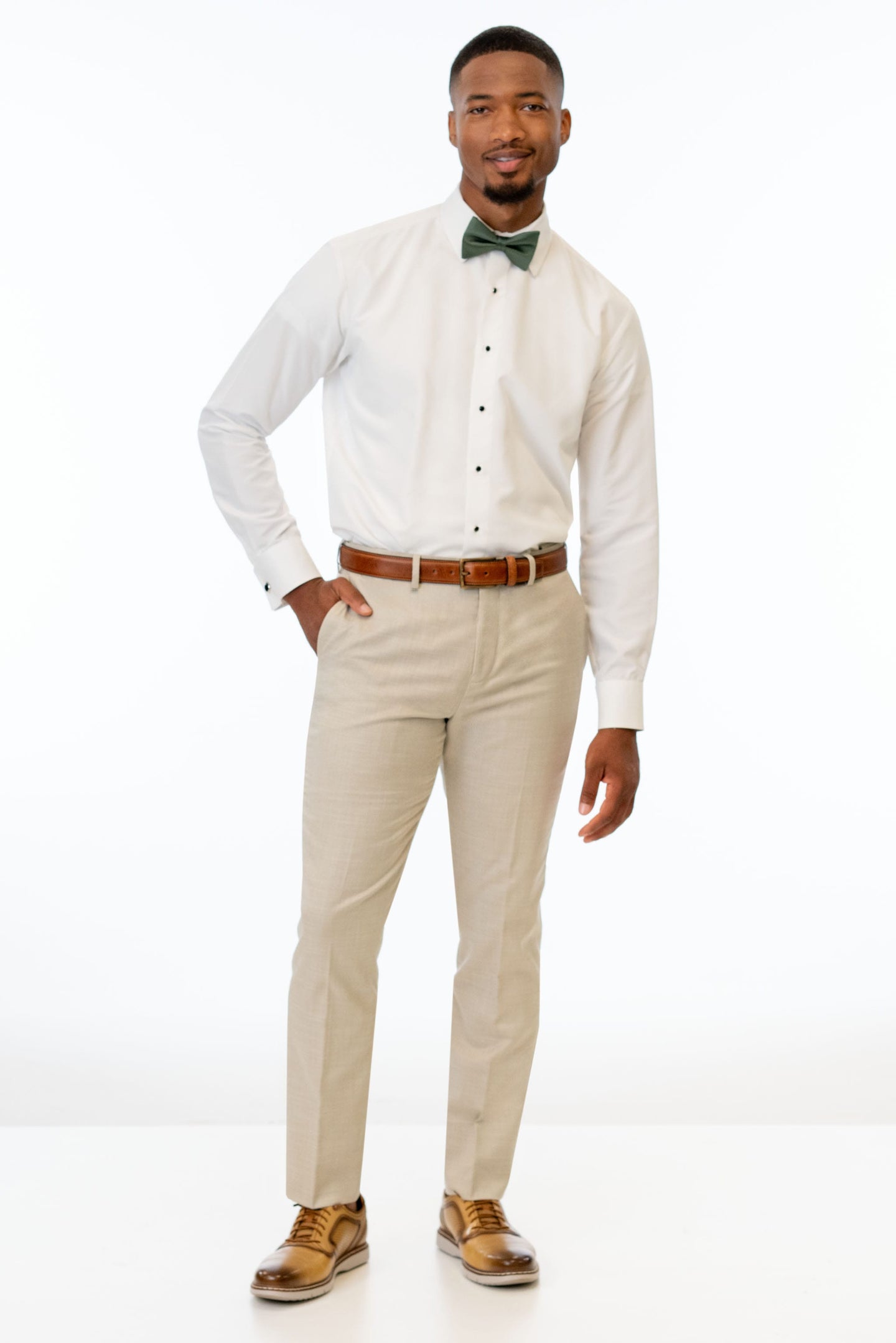 man wearing Tan Performance Stretch Slim Fit Suit pants, white shirt, and bow tie