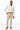 man wearing Tan Performance Stretch Slim Fit Suit pants, white shirt, and bow tie