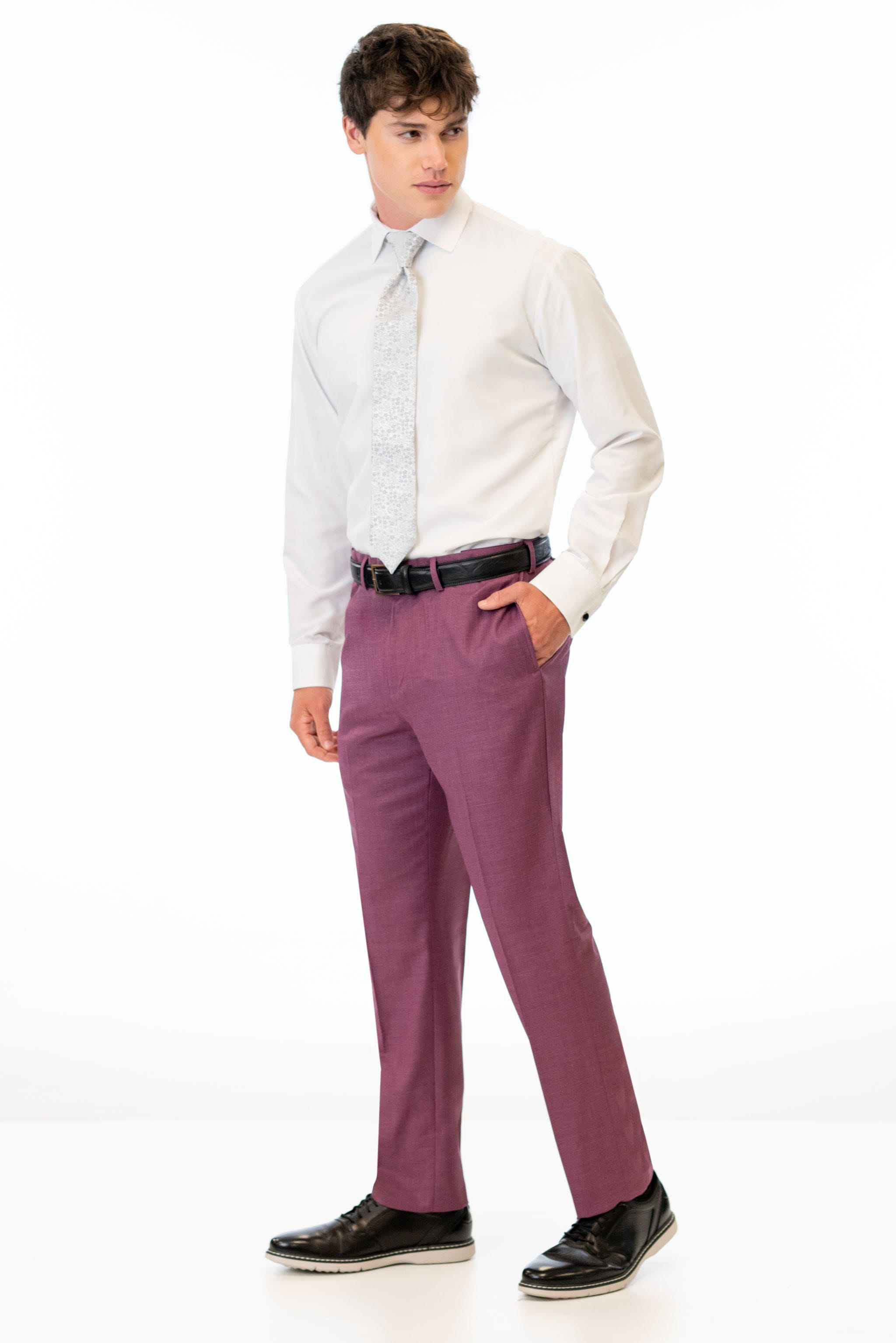 side view of man wearing Violet Stretch Slim Fit Suit pants, white shirt, and silver tie