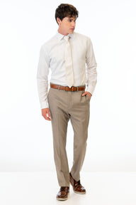 man wearing Wheat Stretch Slim Fit Suit pants, white shirt, and ivory tie