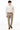 man wearing Wheat Stretch Slim Fit Suit pants, white shirt, and ivory tie