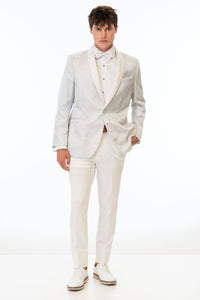 man wearing White Paisley Tuxedo coat with White Euro Slim pants and a white shirt and white bow tie
