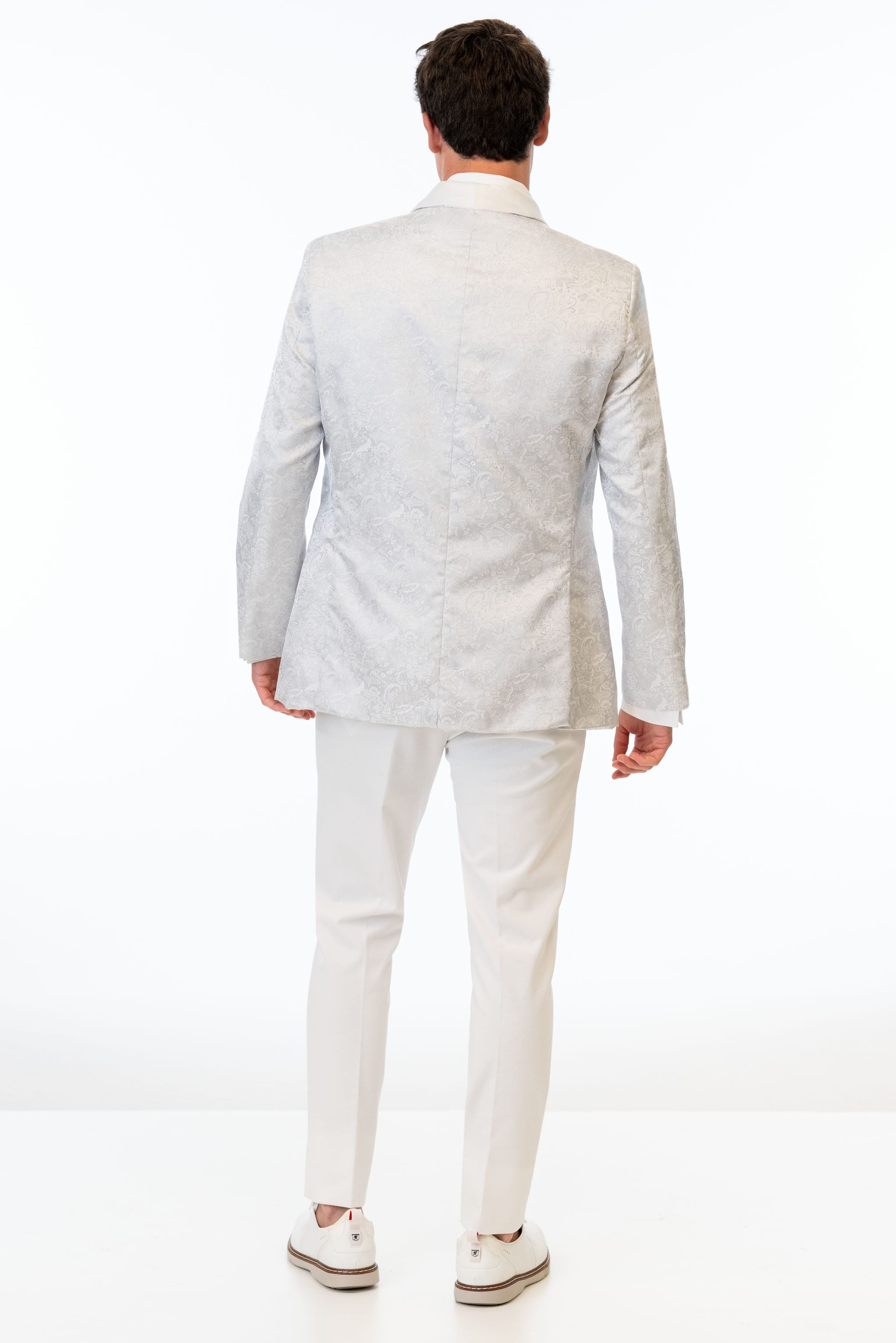 back view of man wearing White Paisley Slim Fit Tuxedo coat and Euro Slim Fit Pants in white