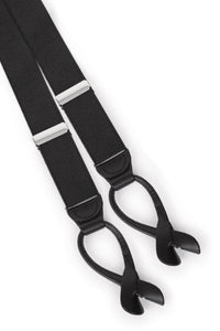 black button-on suspenders with silver metal adjusters and leather button ends on a white background
