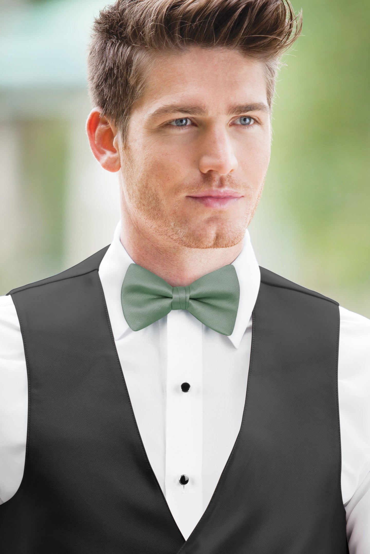 man wearing white shirt, solid dusty sage bow tie, and matching Expressions vest