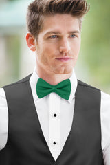 man wearing white shirt, solid emerald green bow tie, and matching Expressions vest