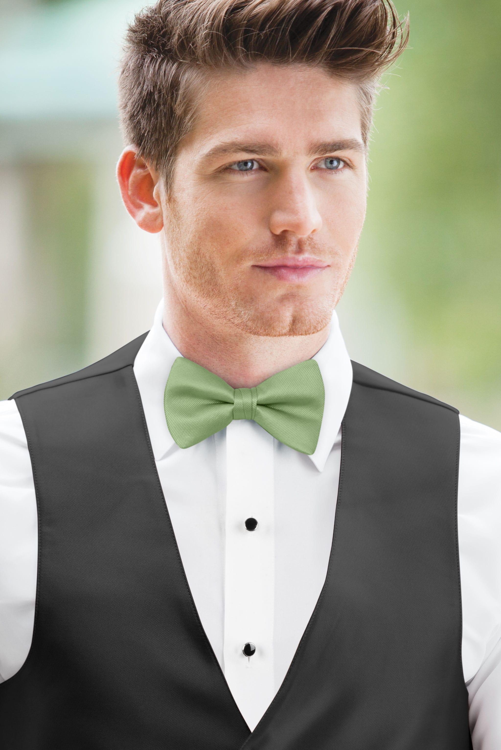 man wearing white shirt, solid meadow bow tie, and matching Expressions vest