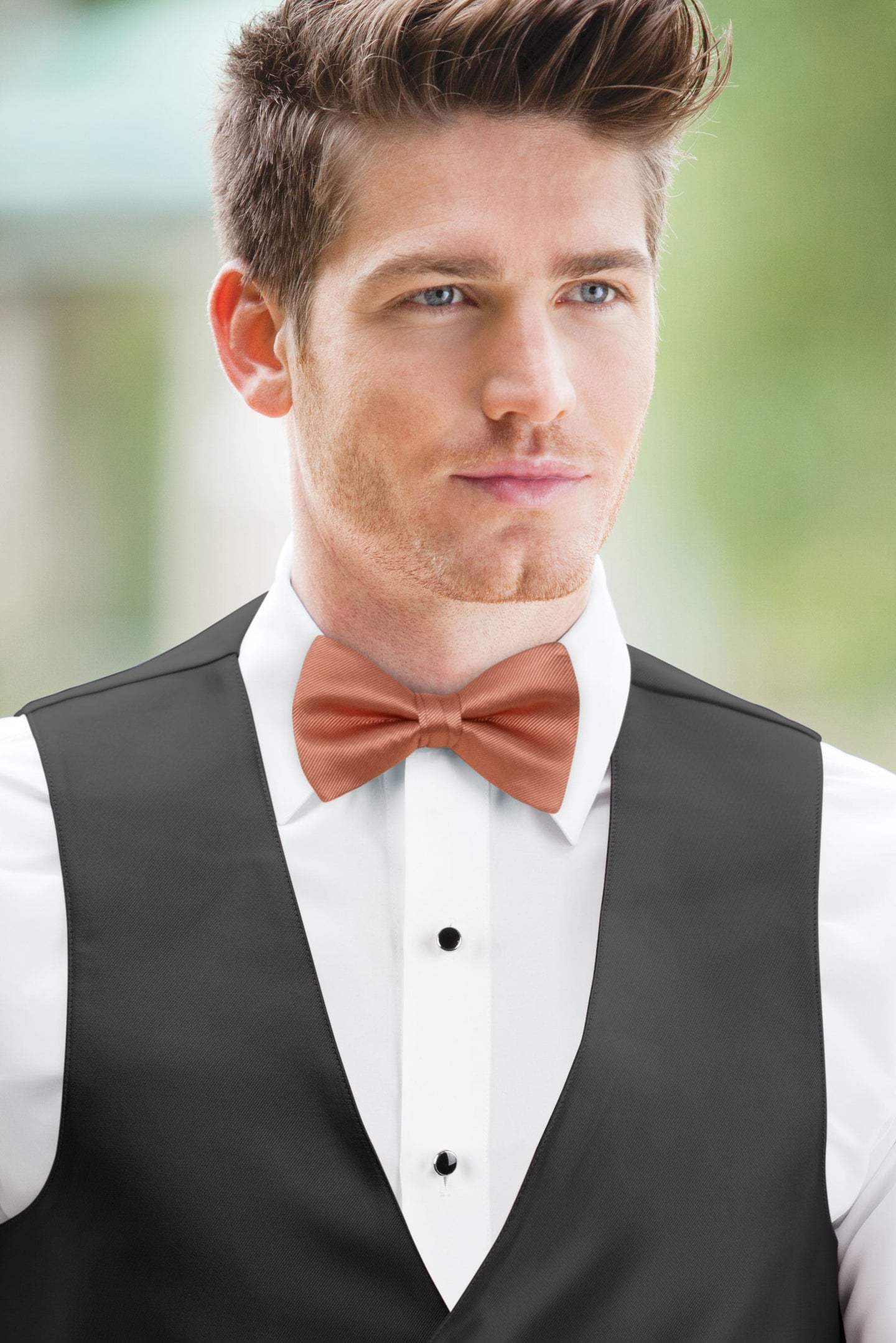 man wearing white shirt, Simply Solids sedona bow tie, and black vest