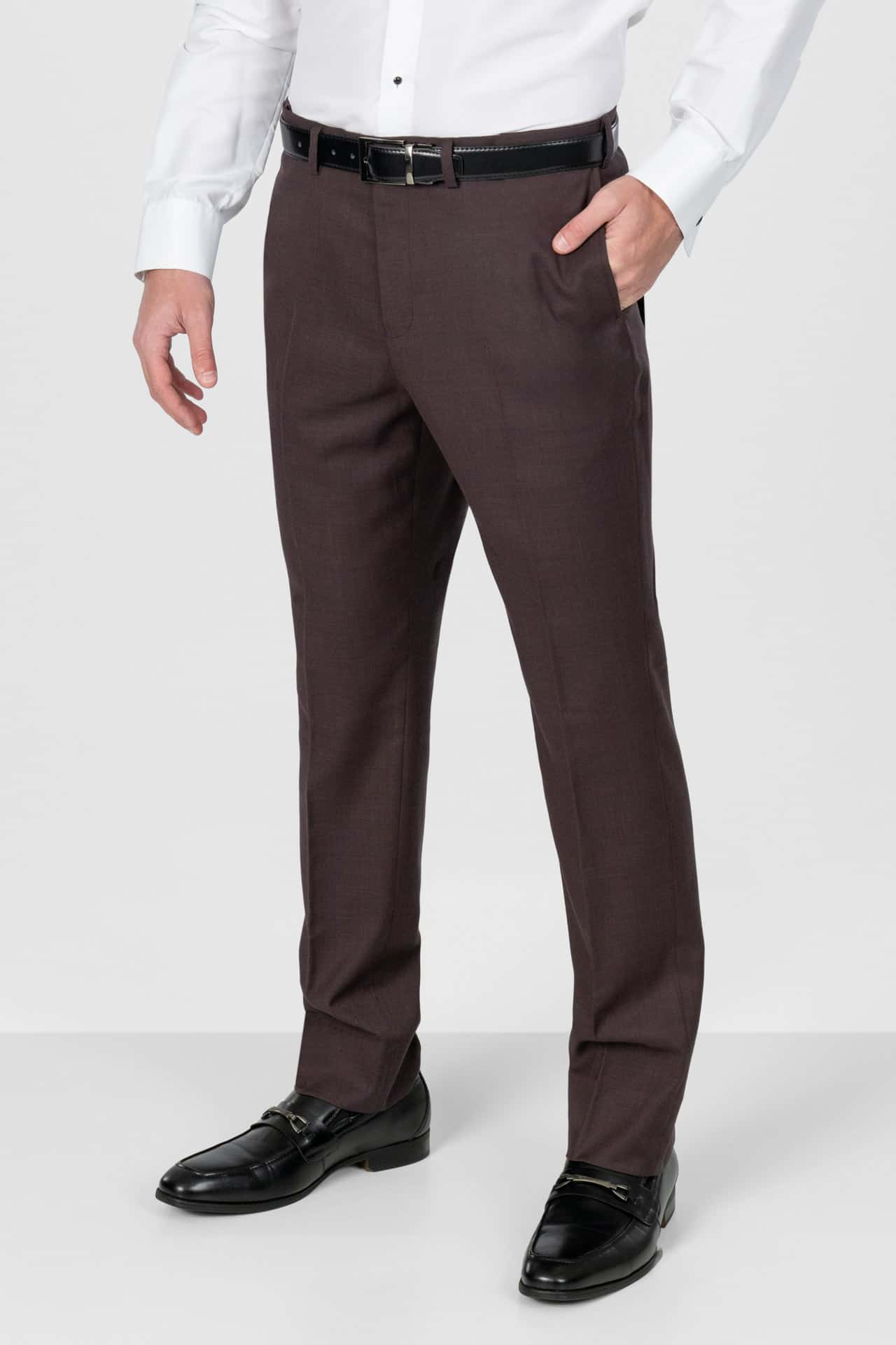 Eggplant pants worn with a white shirt and black shoes on a white background