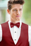 man wearing white shirt, solid apple red bow tie, and matching Expressions vest