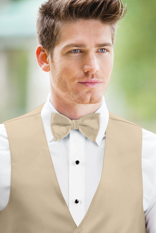 man wearing white shirt, solid champagne bow tie, and matching Expressions vest