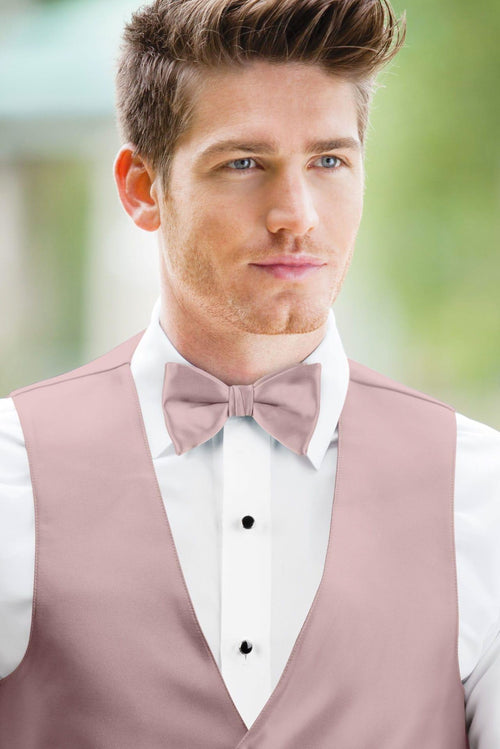 man wearing white shirt, solid first blush bow tie, and matching Expressions vest