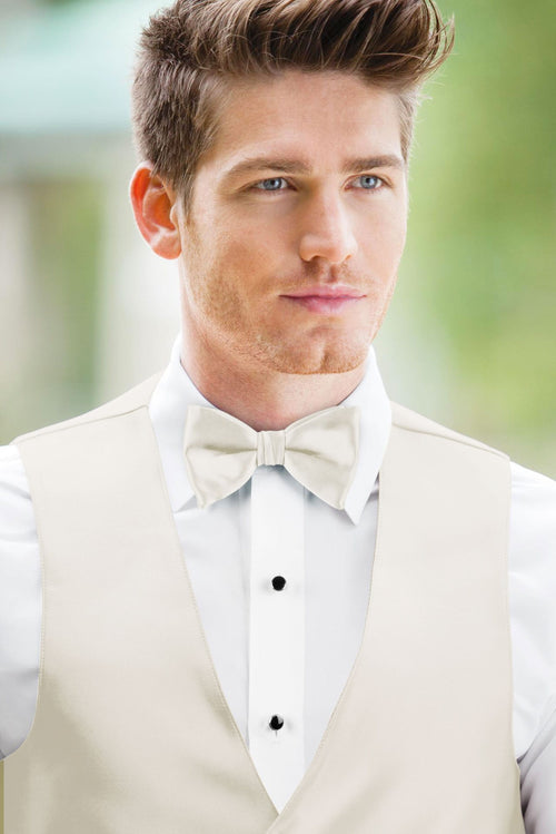 man wearing white shirt, solid ivory bow tie, and matching Expressions vest