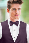 man wearing white shirt, solid plum bow tie, and matching Expressions vest