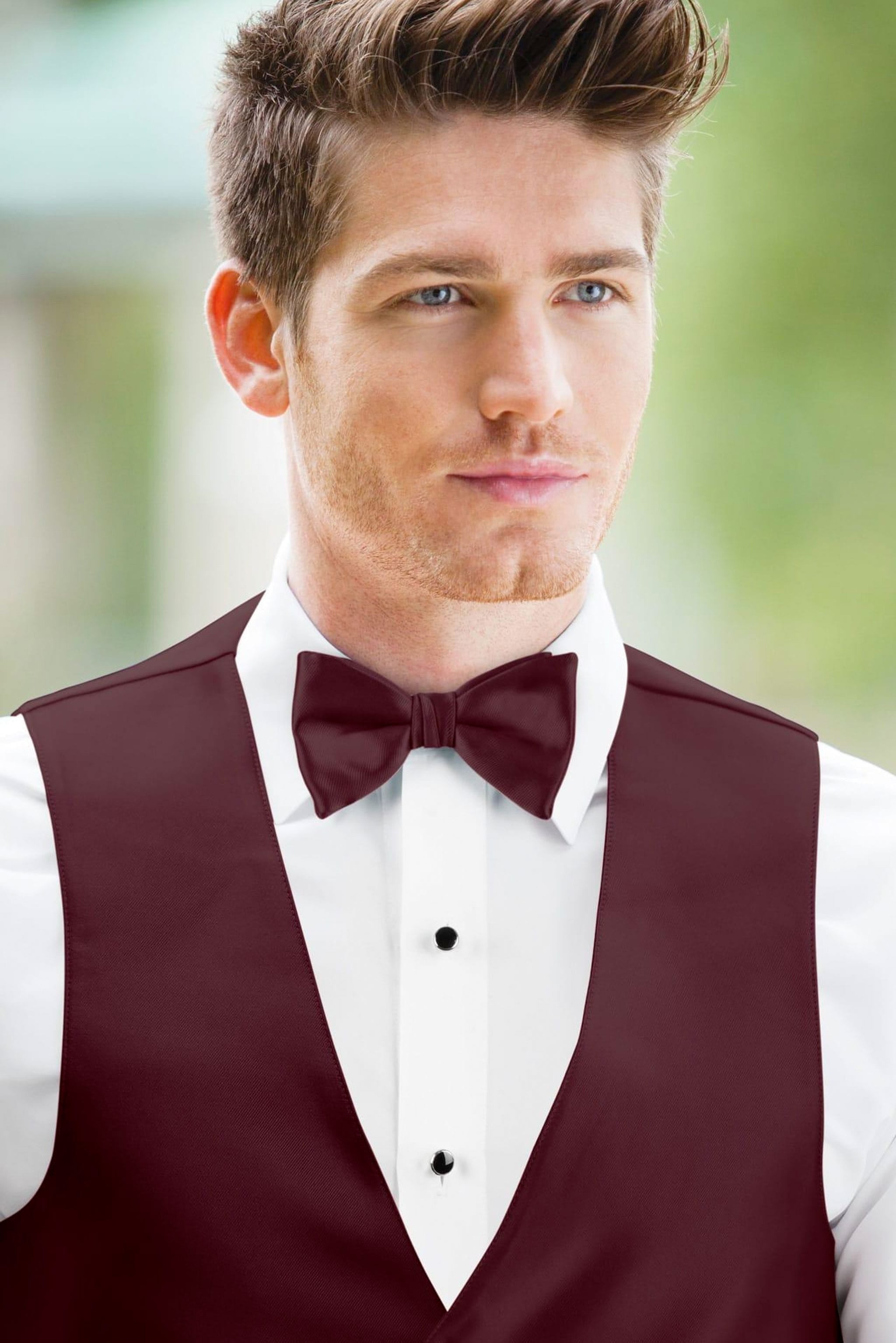 man wearing white shirt, solid wine bow tie, and matching Expressions vest