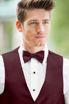 man wearing white shirt, solid wine bow tie, and matching Expressions vest