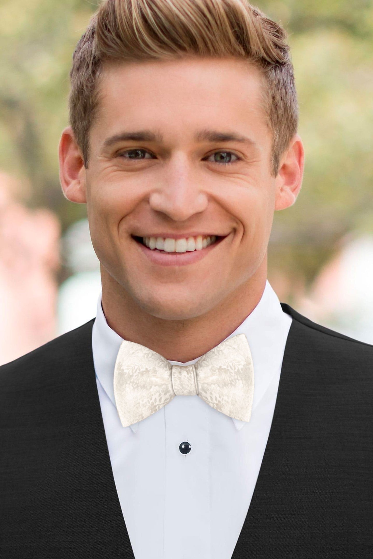 man wearing white shirt, floral ivory bow tie and solid black Expressions vest