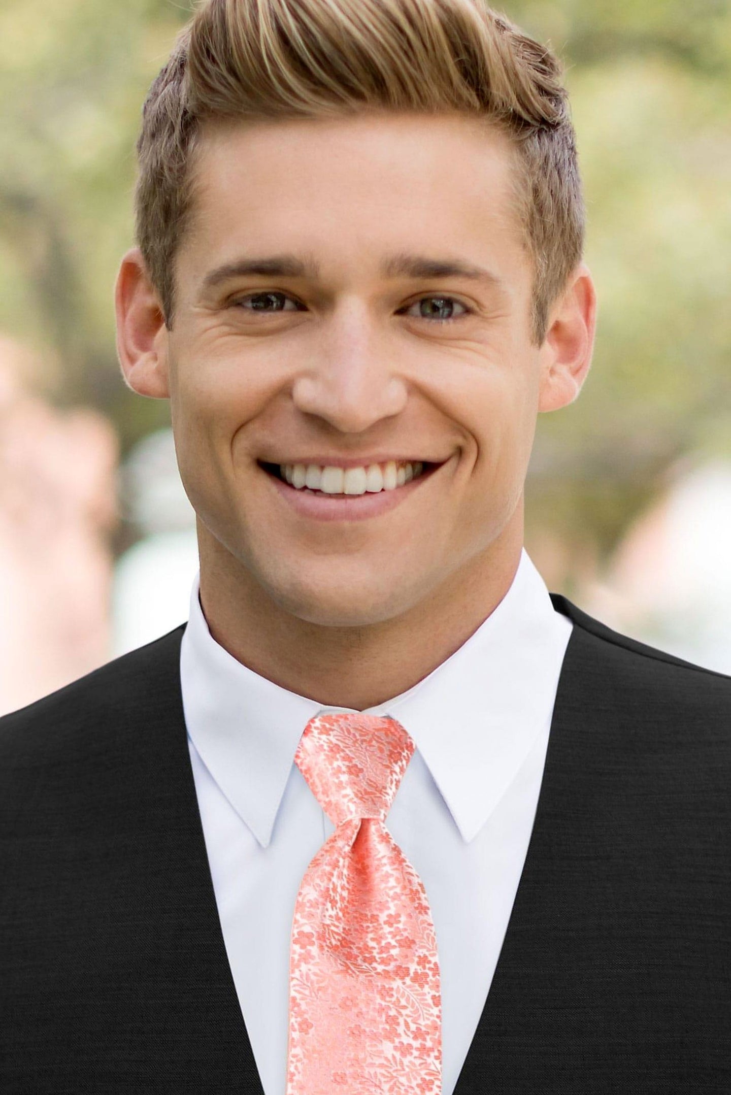 man wearing white shirt, floral dark coral windsor tie and solid black Expressions vest