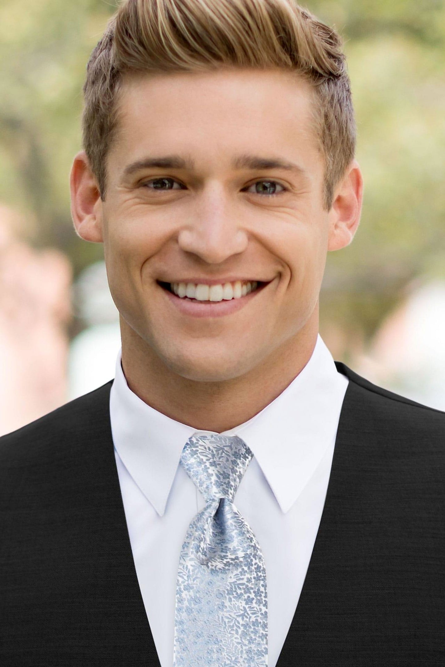 man wearing white shirt, floral dusty blue windsor tie and solid black Expressions vest