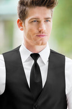 man wearing white shirt, striped black windsor tie and solid black Expressions vest