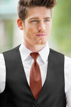 man wearing white shirt, striped cinnamon windsor tie and solid black Expressions vest