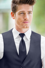 man wearing white shirt, striped navy windsor tie and solid navy Expressions vest