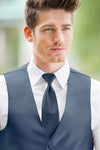 man wearing white shirt, striped slate blue windsor tie and solid slate blue Expressions vest